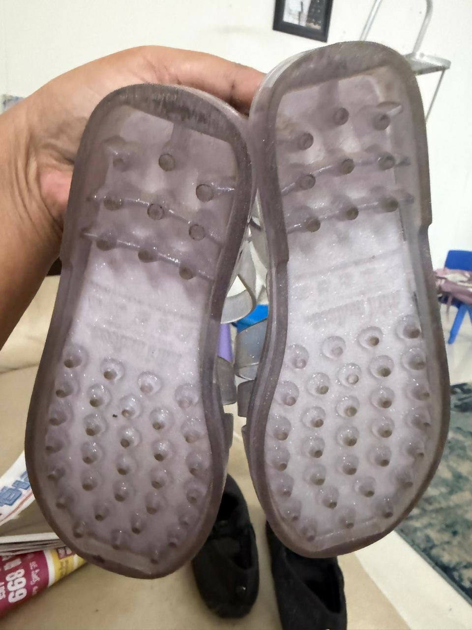 Pair of gray slippers with textured sole 