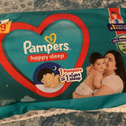 Pampers baby wipes packaging on a textured surface