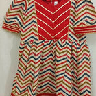 Elevate your baby girl's style with the captivating combination of red and skin color - a perfect blend of vibrancy and warmth for her adorable wardrobe