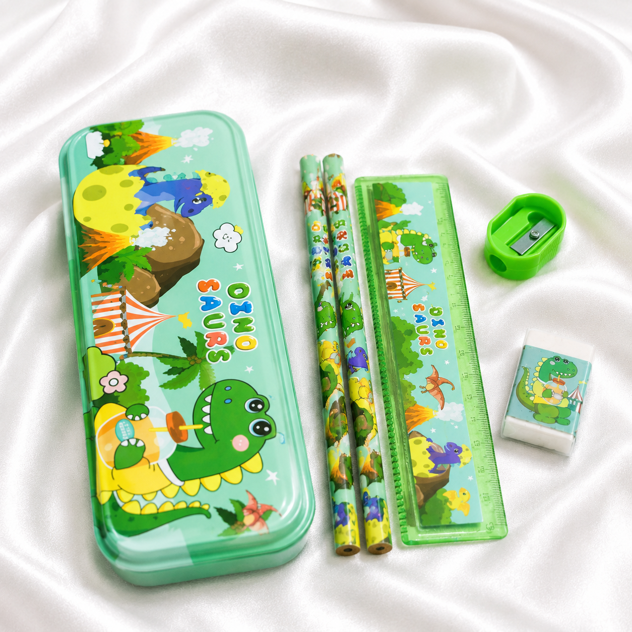 iLearnNGrow Dino Theme Stationery Rakhi Combo featuring a fun dinosaur pencil box set with a matching Dino Rakhi, combining useful stationery and festive fun for kids this Raksha Bandhan.