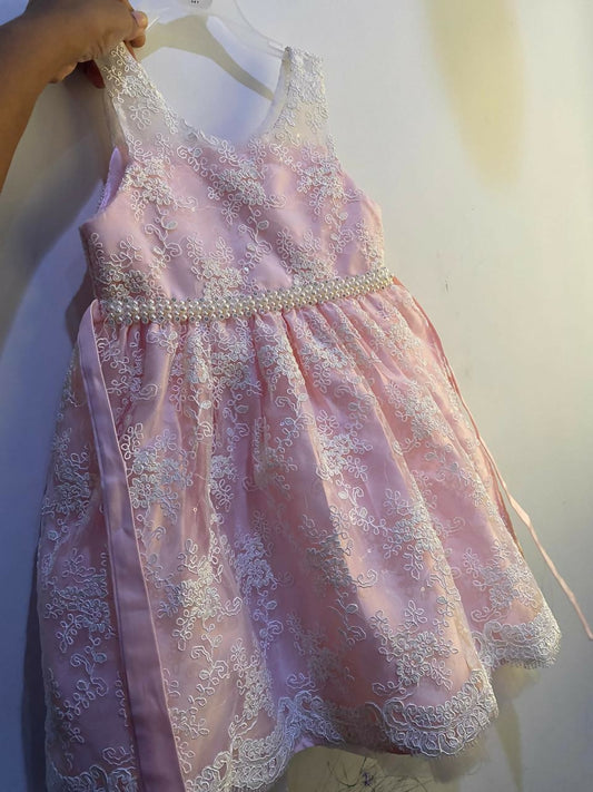 Adorn your baby girl in this elegant Pearl and Lace Work Frock, perfect for making precious memories!






