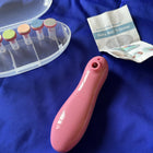 Pink baby nail trimmer with a clear container and instructions on a blue background