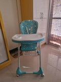 Blue and white baby high chair.