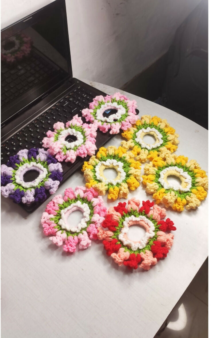 Colorful flower arrangements on a white surface with a black background