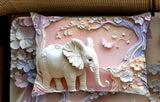 Decorative pillow with an elephant and floral design
