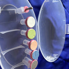 Clear nail buffer with colorful buffers on a blue background