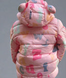 Child wearing a colorful pink puffer jacket with letter patterns 