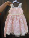 Adorn your baby girl in this elegant Pearl and Lace Work Frock, perfect for making precious memories!






