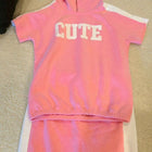 Shop now for the Pink T-shirt with Cap and Short Skirt set, offering comfort, style, and adorable charm for your baby’s everyday wear!