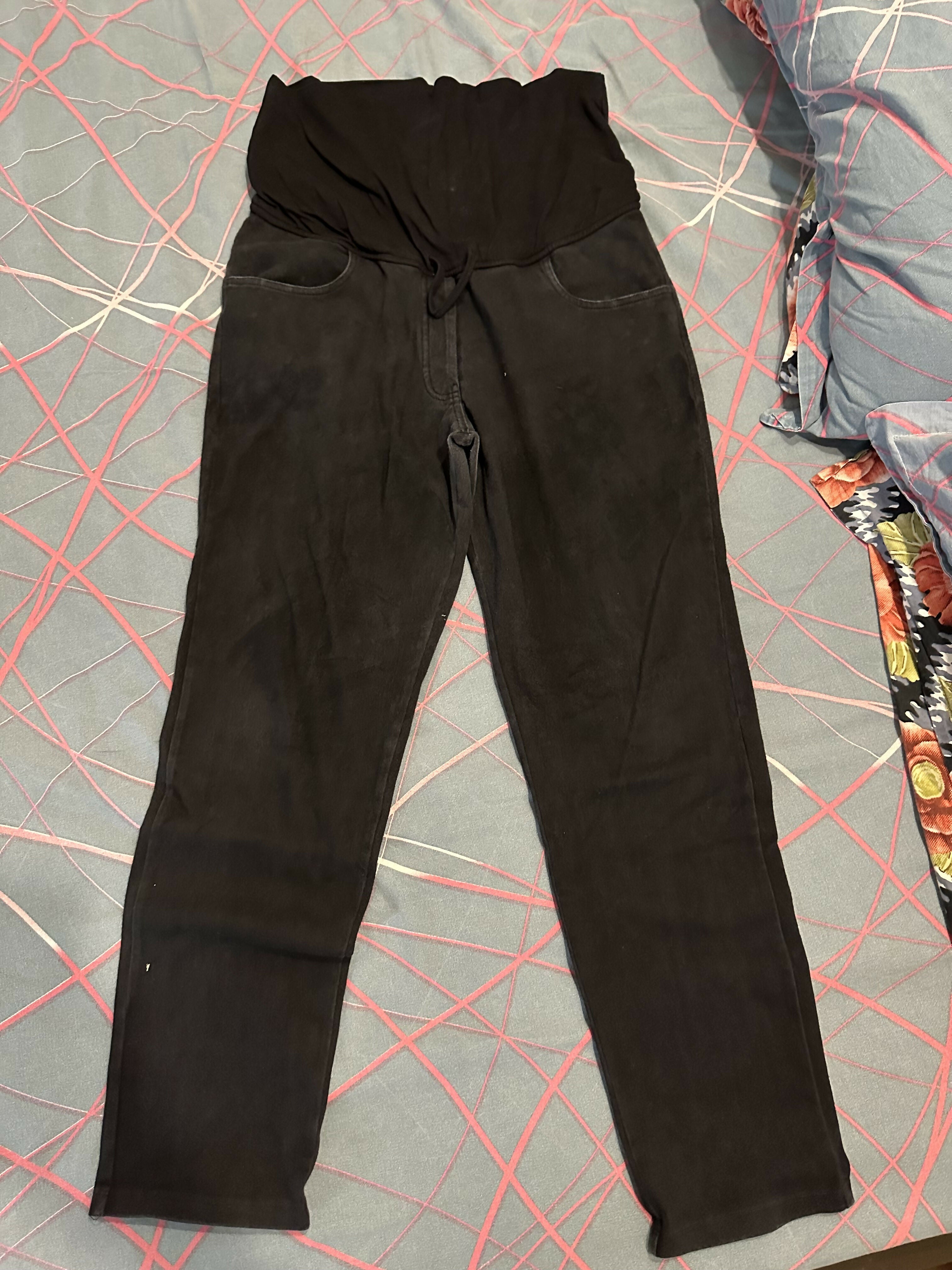 Black pants on a gray surface with red lines