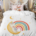 Children's single bed comforter with unicorn and rainbow design on a bed 