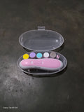 Pink nail art tool set with colorful dots in a clear case on a dark surface