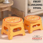 Two orange folding stools with fruit design