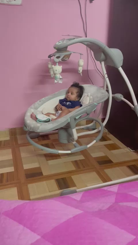 Soothe and entertain your baby with the INGENUITY Baby Electric Swing in Grey, featuring multiple speed settings, recline positions, and built-in melodies for customizable comfort and convenience.