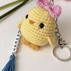 Yellow chick keychain with pink flower and tassel