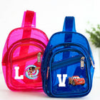 Pink and blue transparent backpacks with cartoon characters on a white background