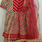 Elevate your baby girl's style with the captivating combination of red and skin color - a perfect blend of vibrancy and warmth for her adorable wardrobe