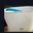 Efficient and convenient PHILIPS Avent Sterilizer for baby bottles and essentials, using natural steam to eliminate 99.9% of germs for safe, thorough sterilization.