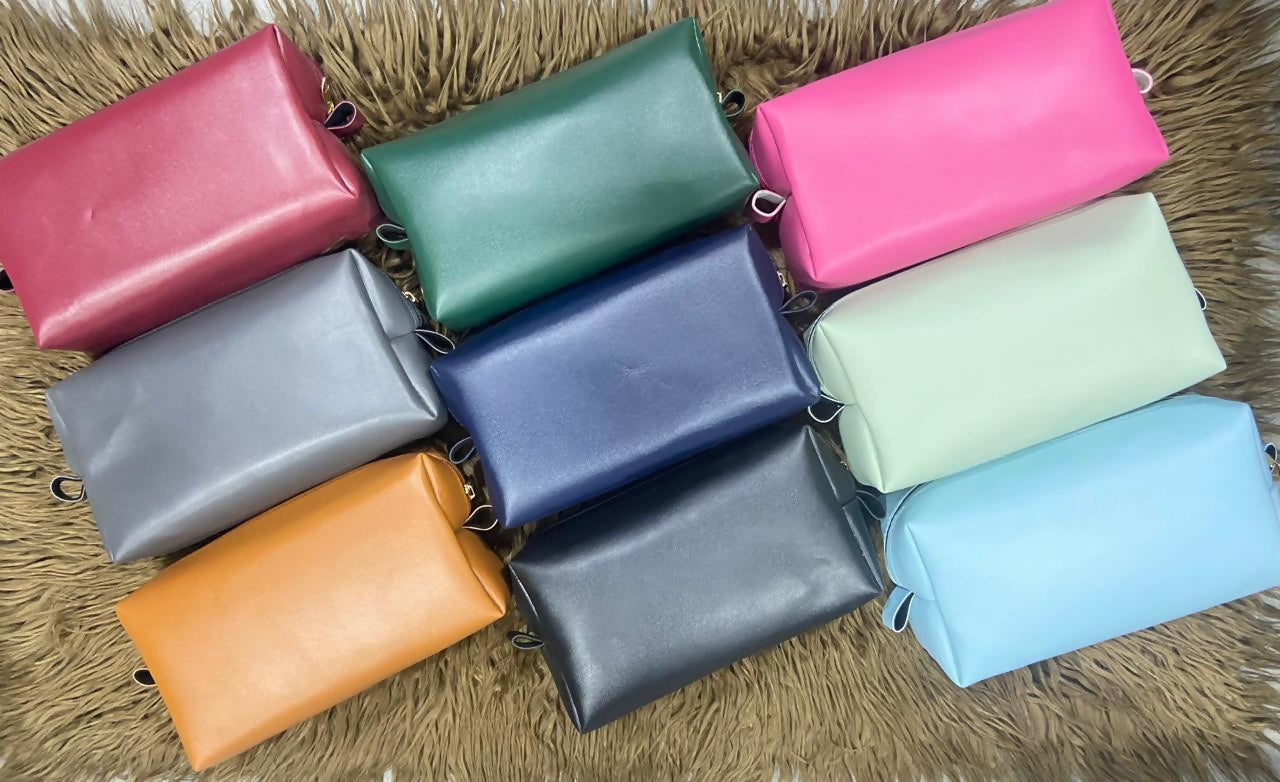 Collection of colorful leather pouches 