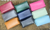 Collection of colorful leather pouches 