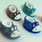 Set of colorful baby shoes with animal designs