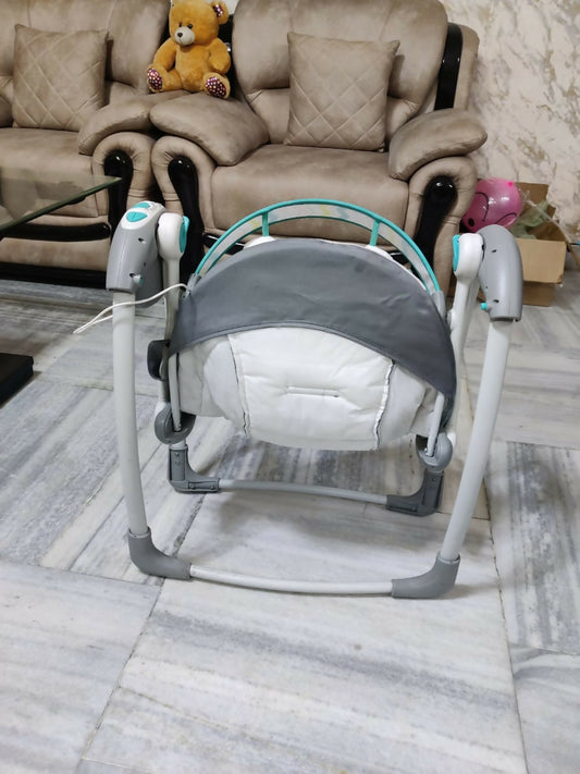 Discover the MASTELA Deluxe Portable Swing, featuring multiple swing speeds, a plush padded seat, and a five-point safety harness, designed for comfort and security, perfect for at home and on the go.