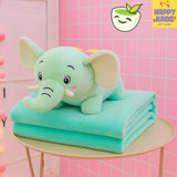 Green elephant plush toy with a blanket on a pink background, featuring the Happy Krao logo.