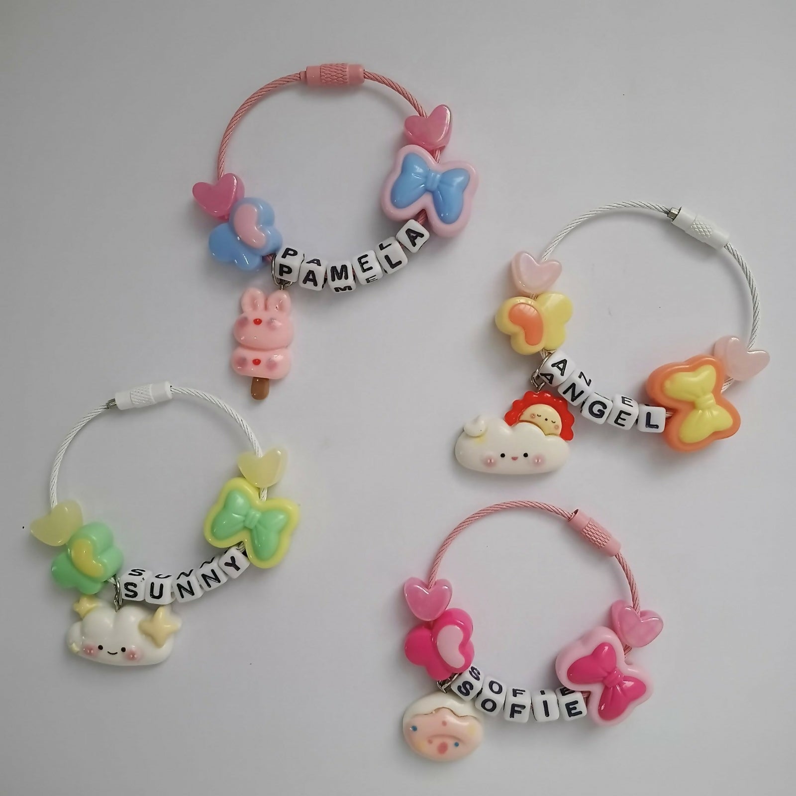 Set of colorful hair ties with cartoon characters and personalized names 