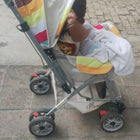 Stroller with a colorful canopy 