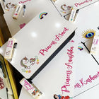 Collection of personalized name cards with cartoon designs on a white surface.