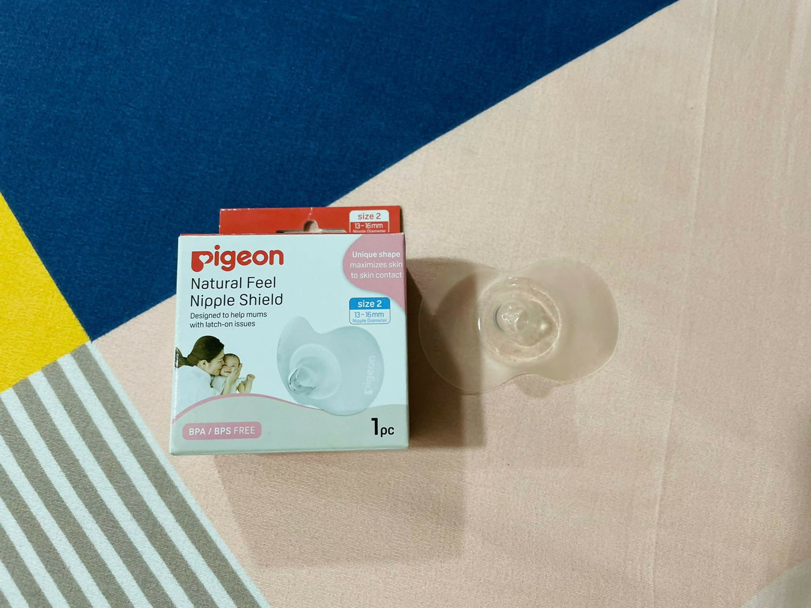 Discover the PIGEON Natural Feel Nipple Shield, crafted from ultra-soft, BPA-free silicone, designed for a natural breastfeeding experience, protecting sore nipples while ensuring proper latching.