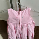 Pink children's dress with floral patterns