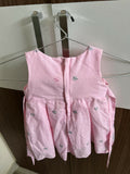 Pink children's dress with floral patterns