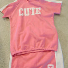 Shop now for the Pink T-shirt with Cap and Short Skirt set, offering comfort, style, and adorable charm for your baby’s everyday wear!
