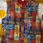 Colorful patchwork vest on a mannequin against a yellow and white background