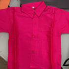 Pink jacket on a table with a colorful background