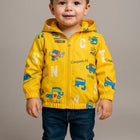 Child wearing a yellow jacket with colorful designs