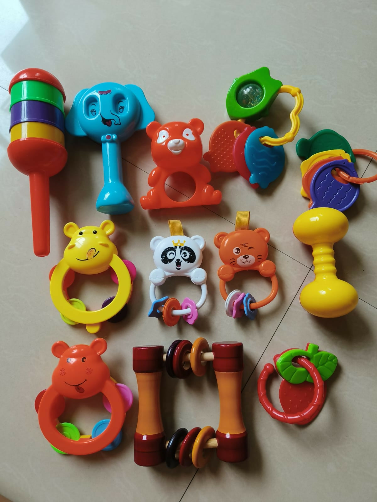 Shop now for the Set of 12 Rattles and Teethers, offering a variety of colorful, safe, and engaging toys to stimulate your baby's senses and provide teething relief!