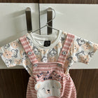 Children's outfit with pink bear-themed overalls and shirt 