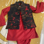 Red outfit with black floral vest 