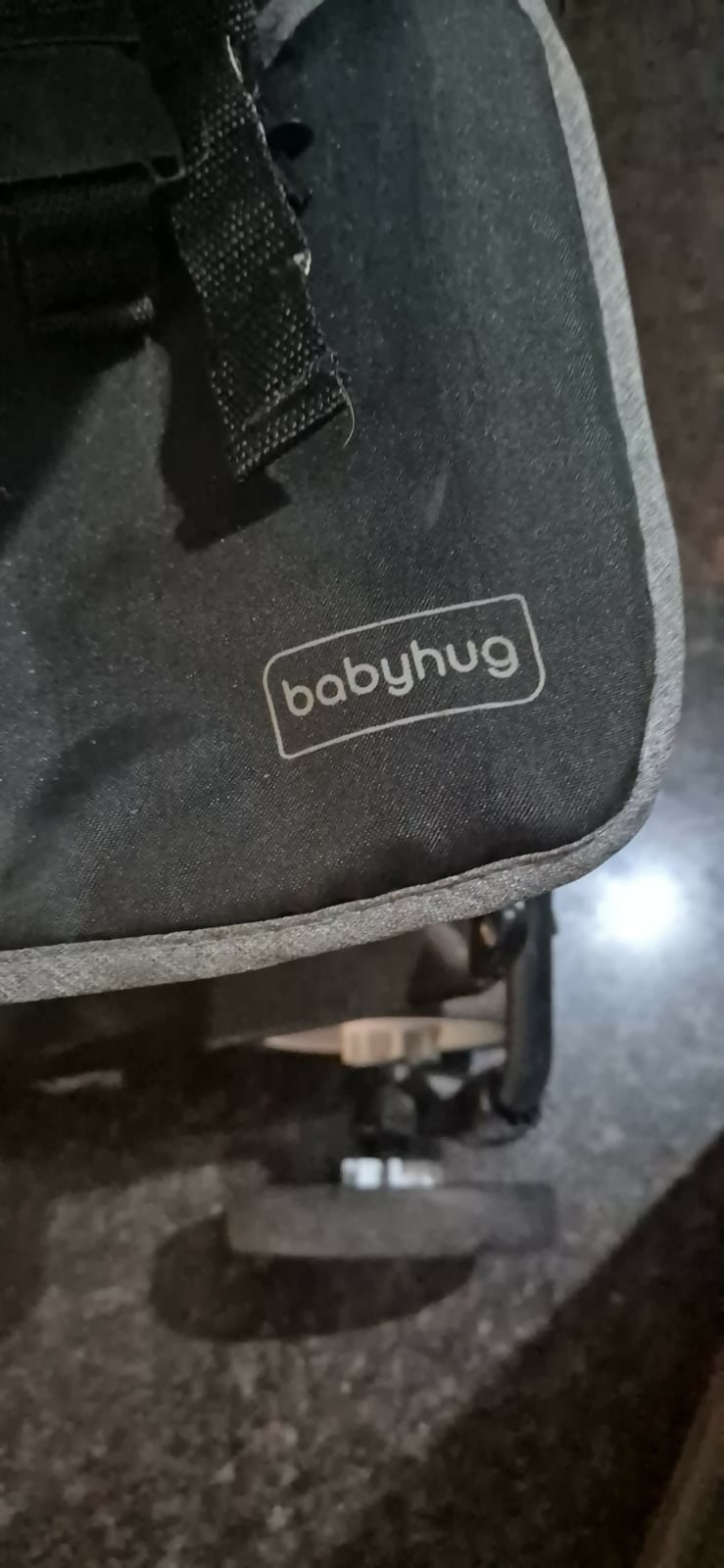 Black baby bag with 'babyhug' logo on a dark surface