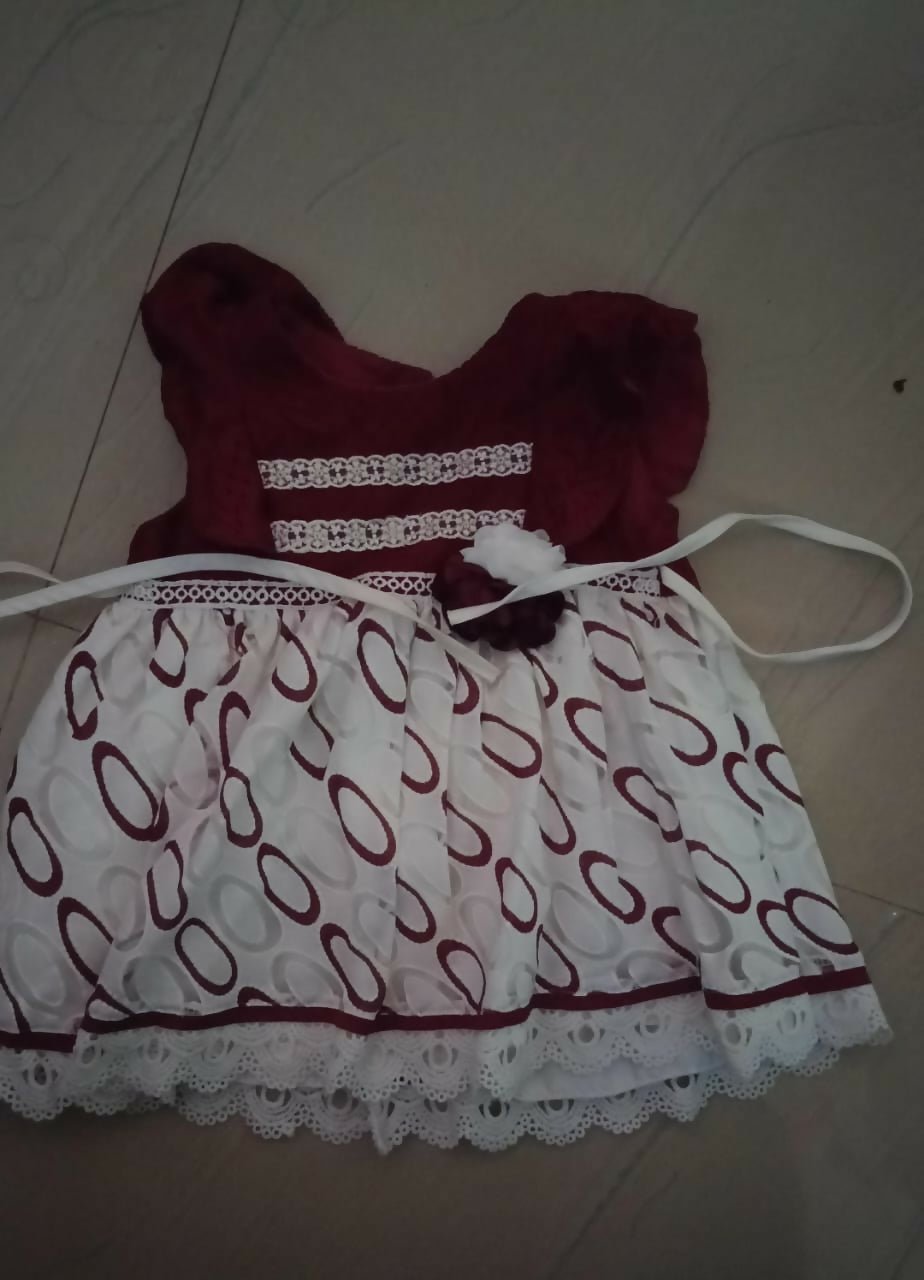 Children's dress with red and white pattern 