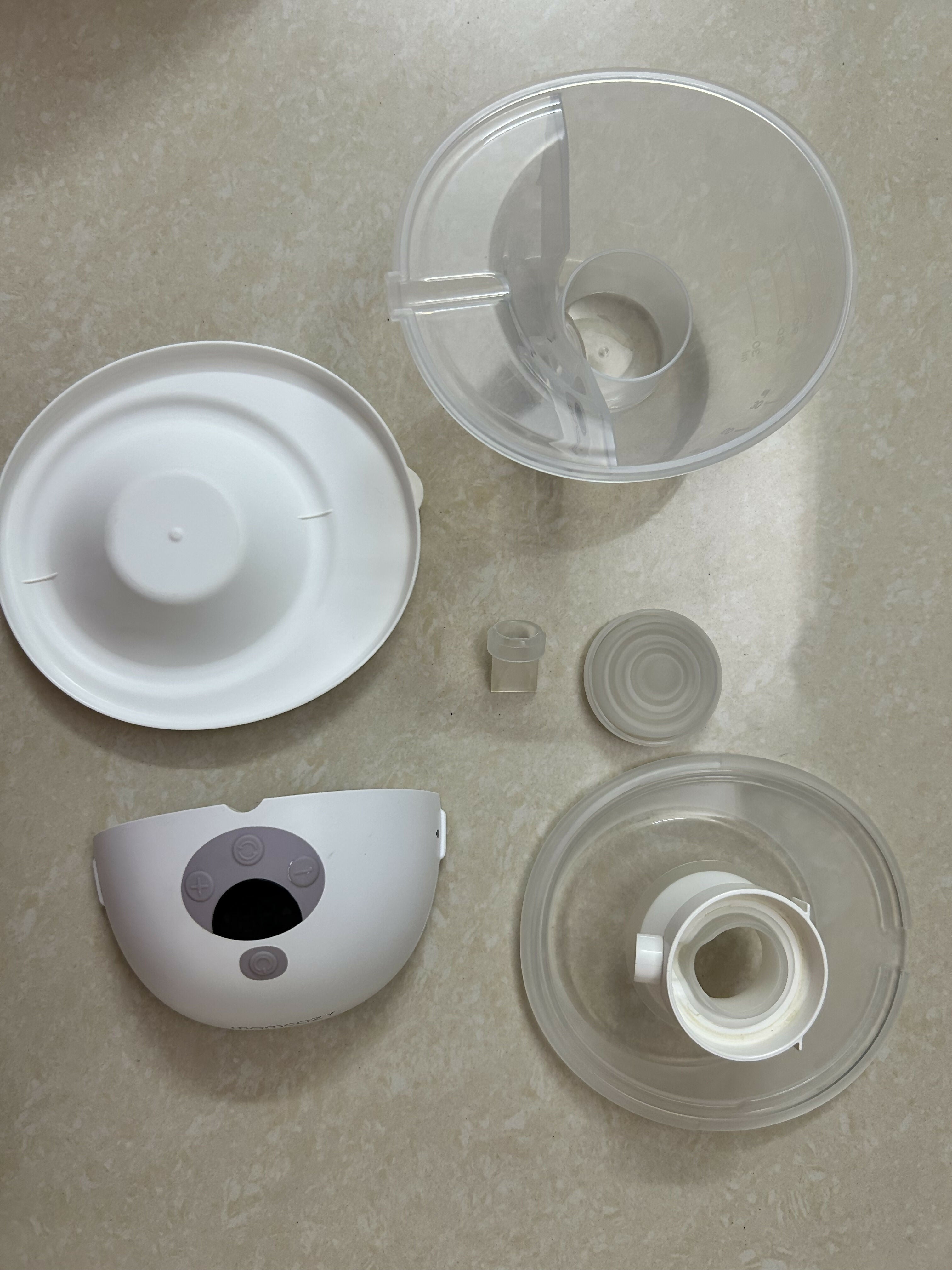 Set of plastic components on a beige surface