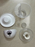 Set of plastic components on a beige surface