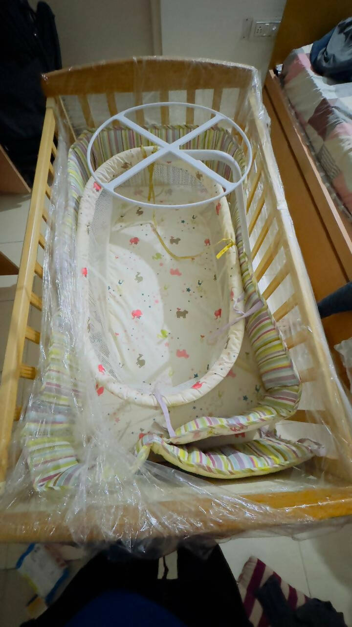 Create a safe haven for your baby with our durable and stylish cot - easy assembly, premium materials, and mosquito net included!